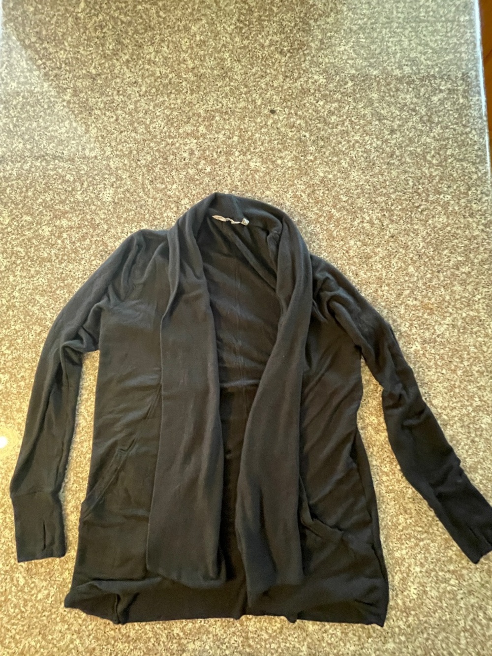 Athleta Pranayama wrap  size Medium  Black color  Thumb holes  Pockets